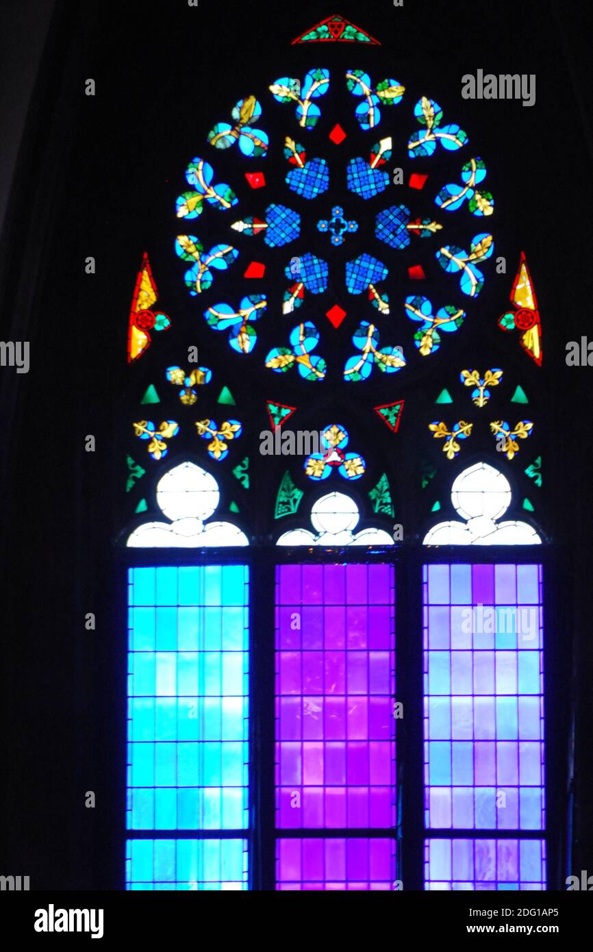 Bright and colourful shining church windows with decorations in vienna Stock Photo