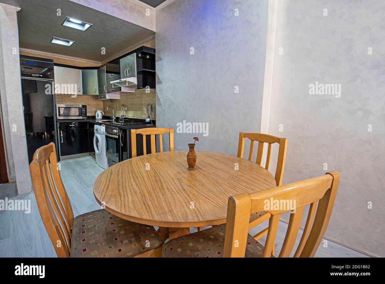 Dining room area in luxury apartment show home showing open plan ... - Kitchen And Dining Area In Luxury Apartment