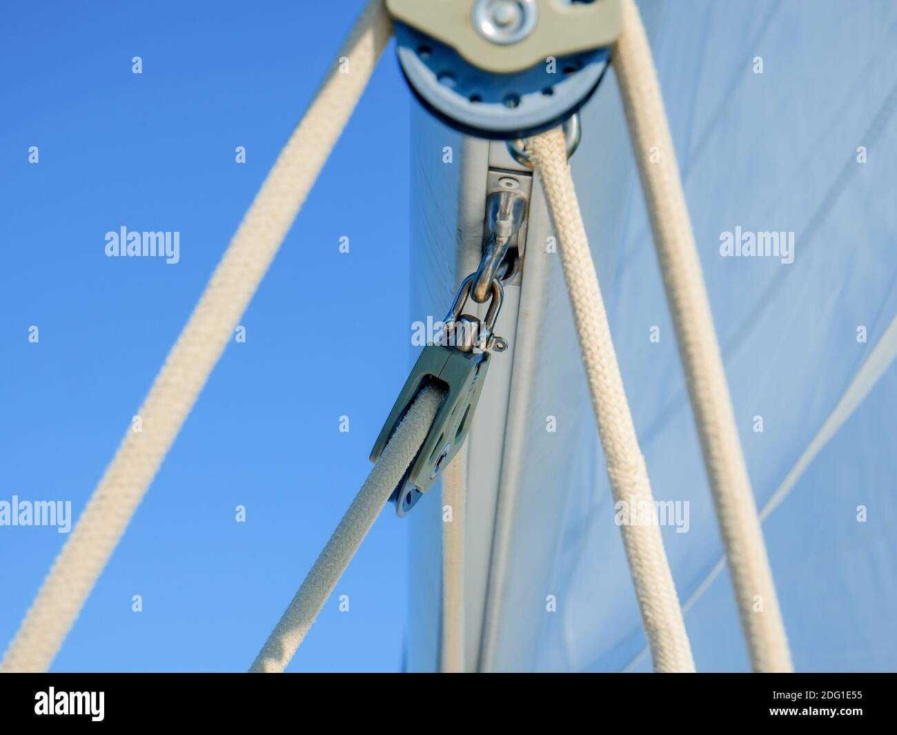 A soft focus of ropes and hooks and travelers attached to boom Stock Photo