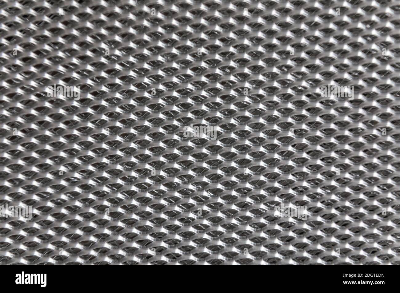 Aluminium mesh pattern on black gradient background vector Stock Photo