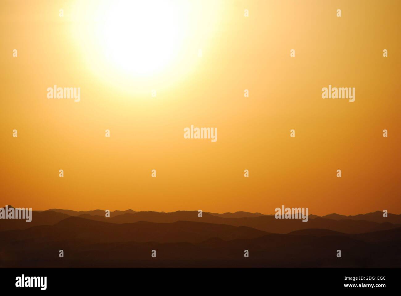 Sunset with mountains in the desert Stock Photo