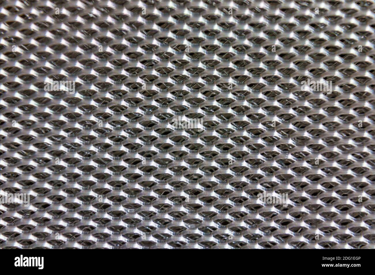 Aluminium mesh pattern on black gradient background vector Stock Photo