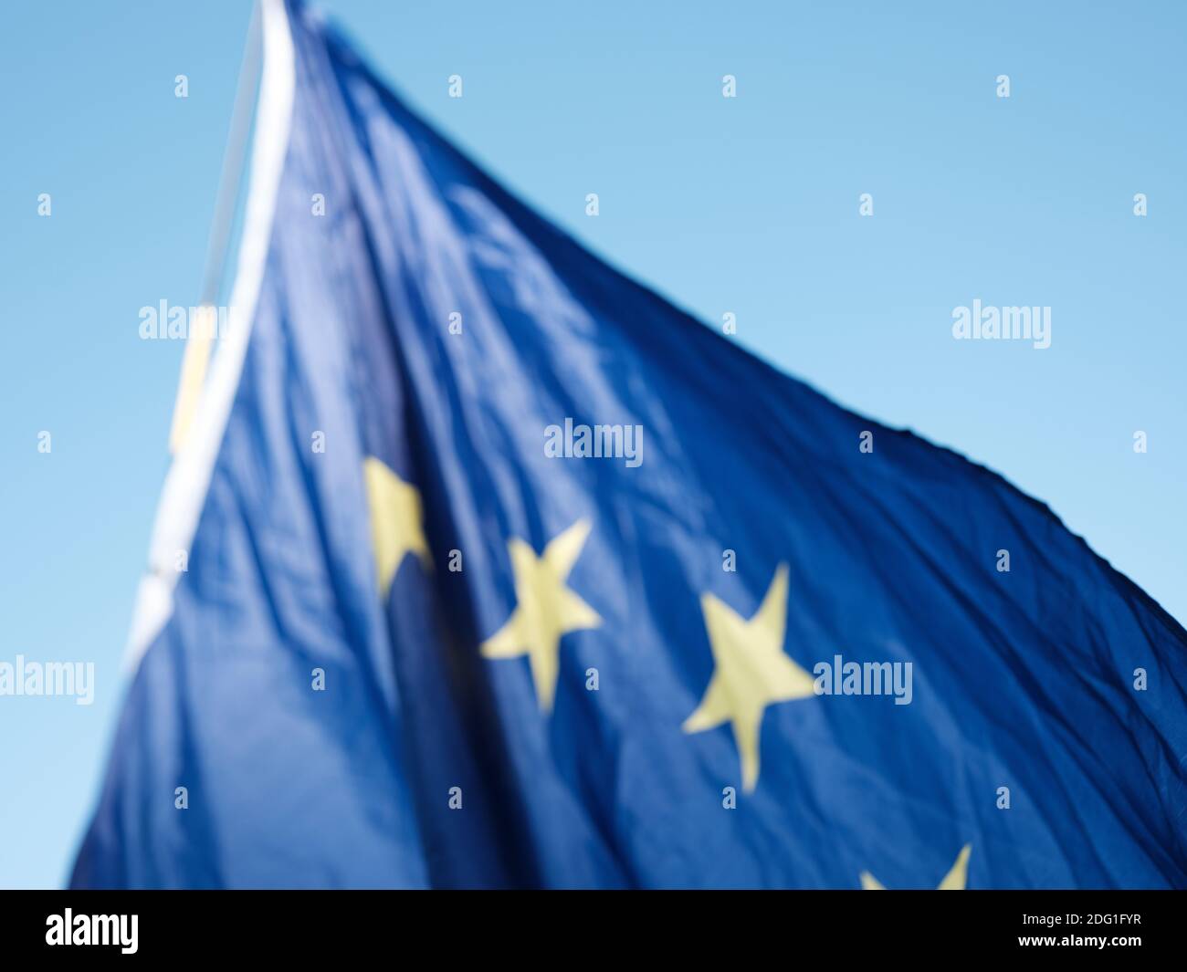 An out-of-focus EU flag outside the gate of the House of Parliament (Palace of Westminster), London, United Kingdom. January 28, 2019. Stock Photo