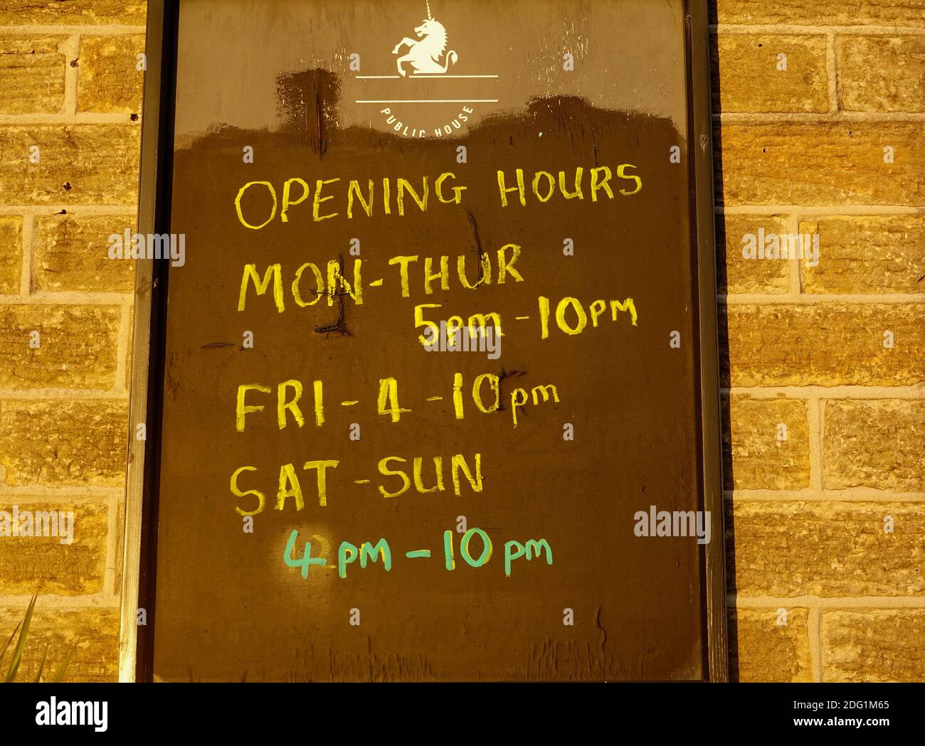 Reduced opening hours at the Hare and Hound pub in New Mills, Derbyshire, due to Covid restrictions. Stock Photo