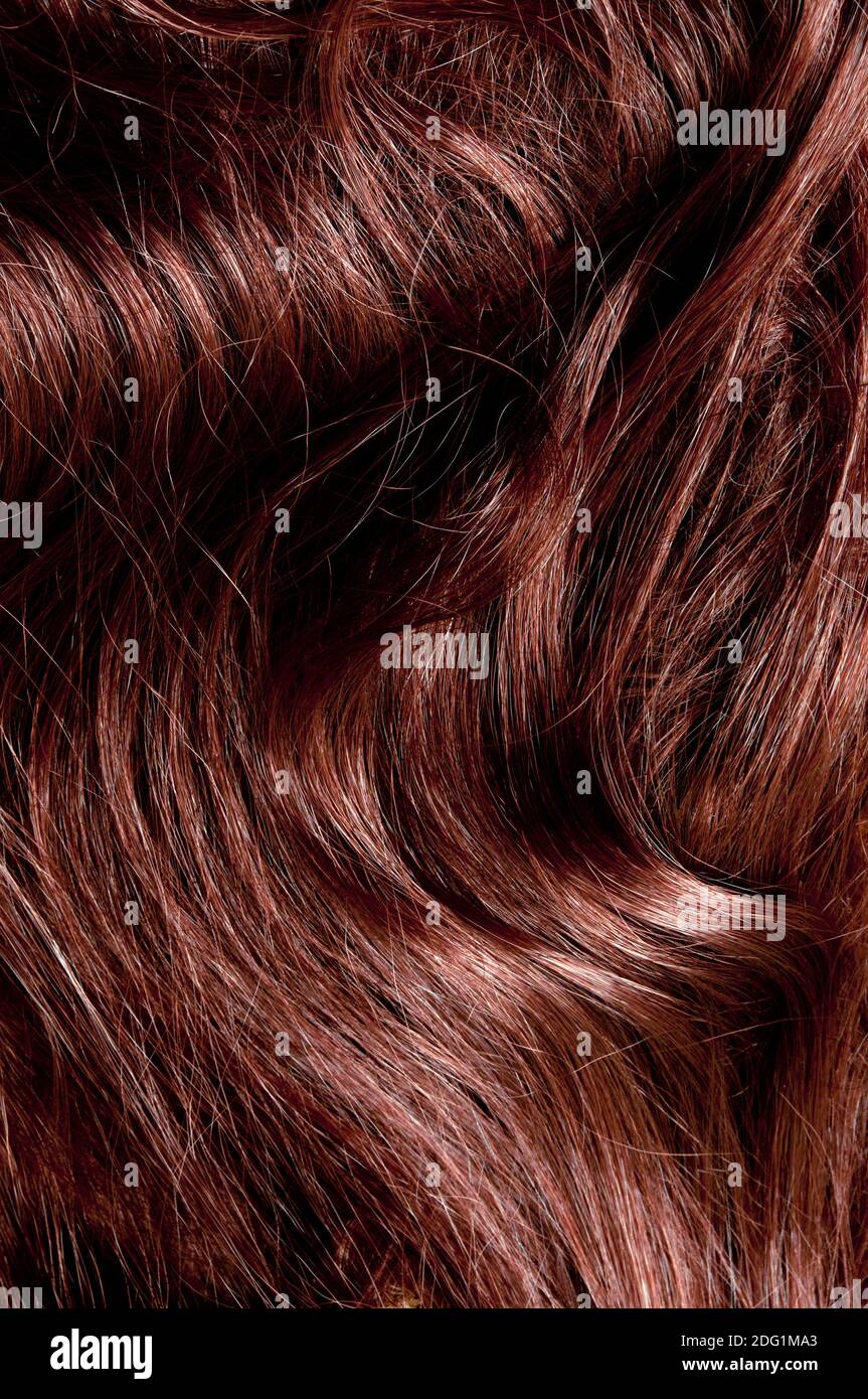 background close up of a woman red hair Stock Photo