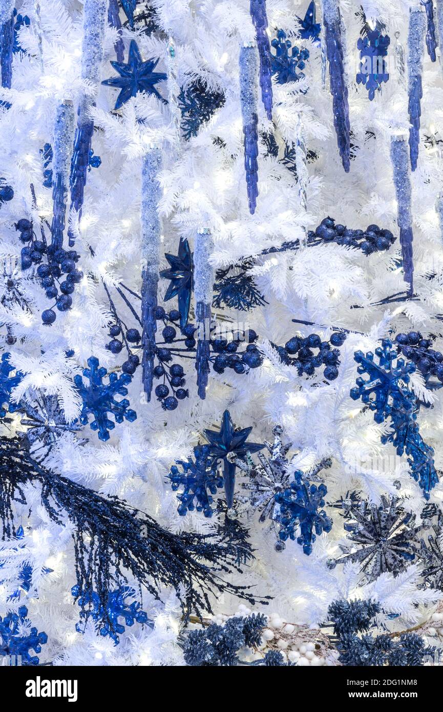 White Christmas tree with blue ornaments, USA Stock Photo