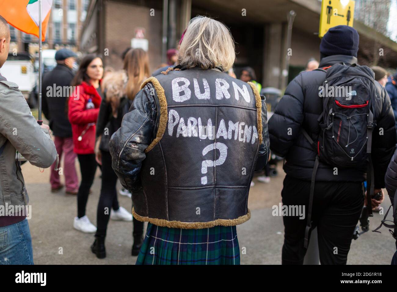 Anti-lockdown protest in Stratford, London, 5 December 2020. Text on the back of a protester's leather jacket. Stock Photo