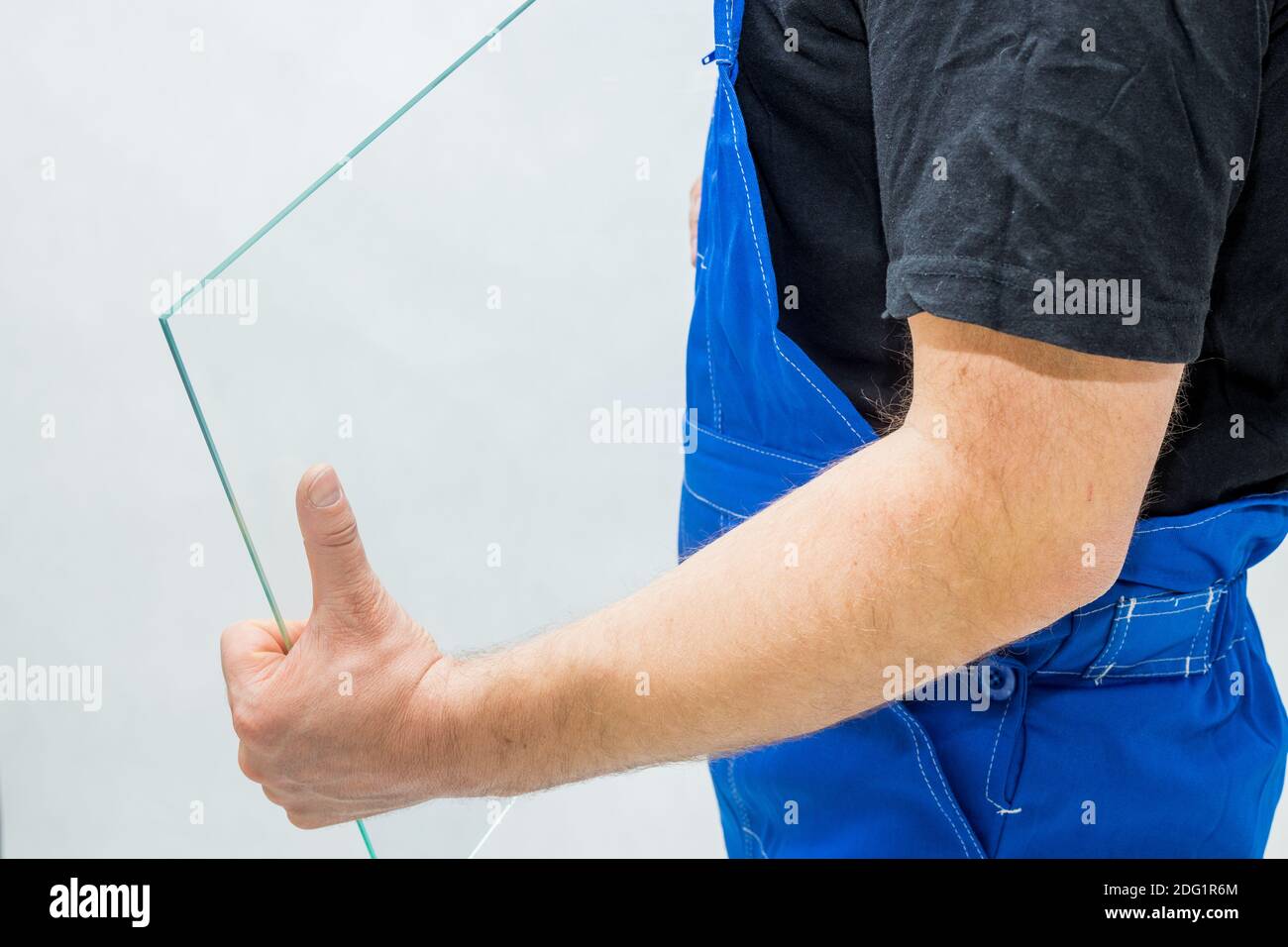 A worker holding a glass in his hands Stock Photo