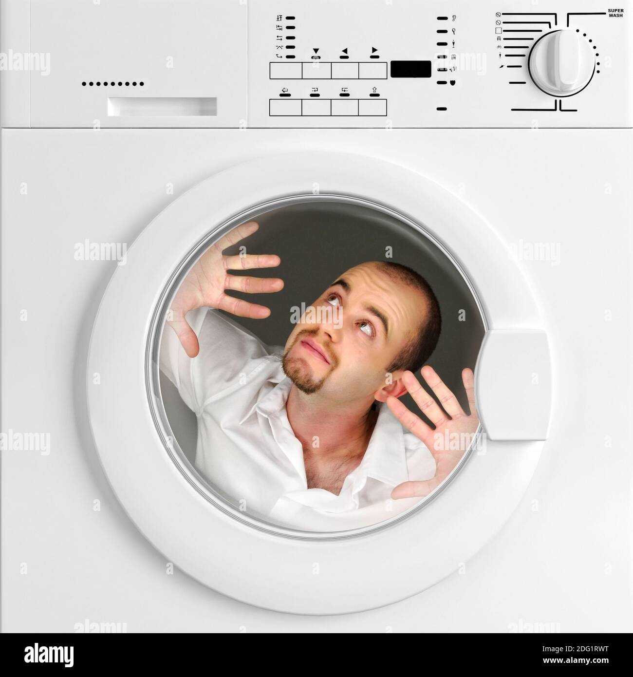 Funny portrait of man inside washing machine Stock Photo - Alamy