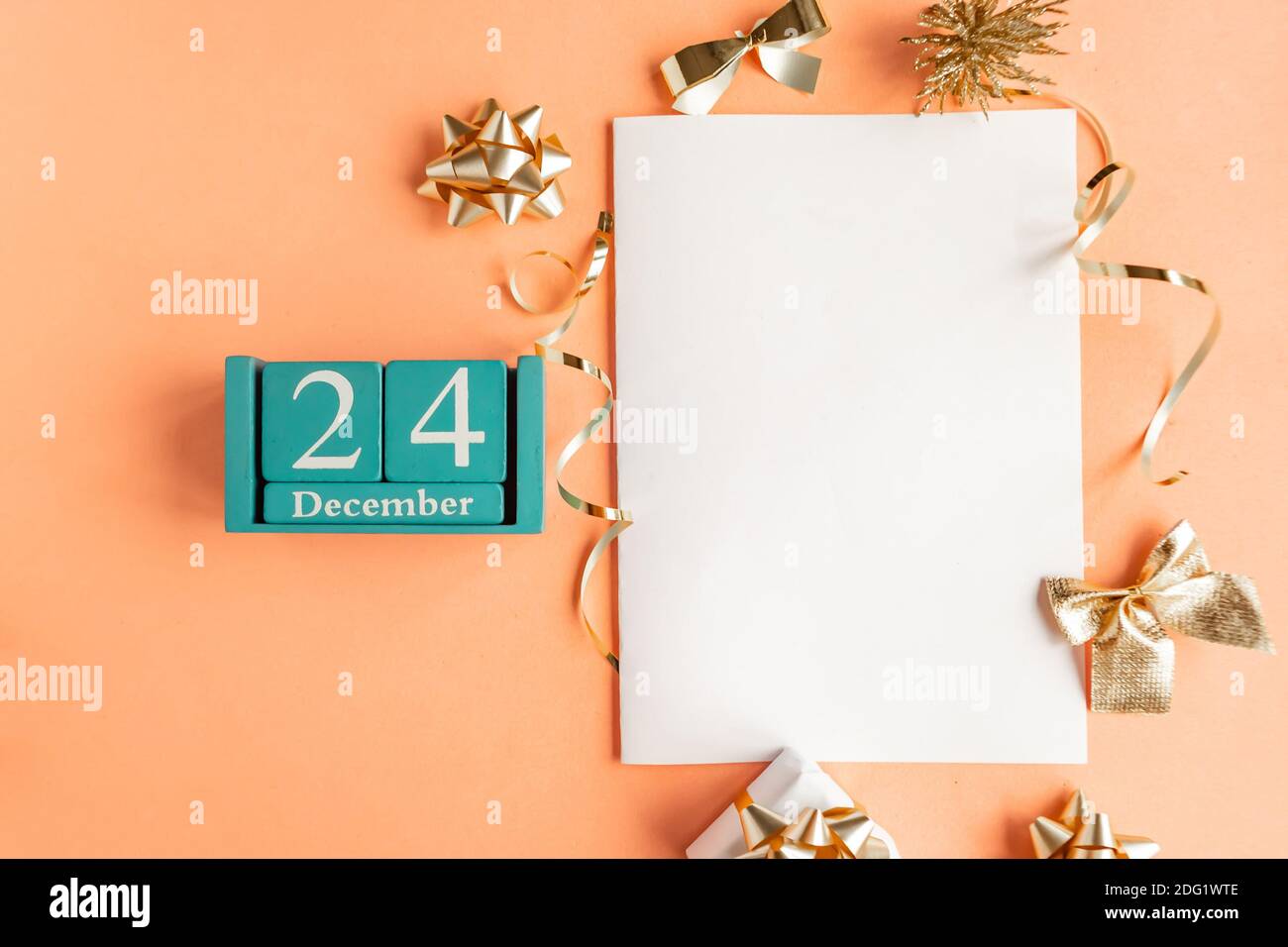December 24. Blue cube calendar with month and date and white mockup ...