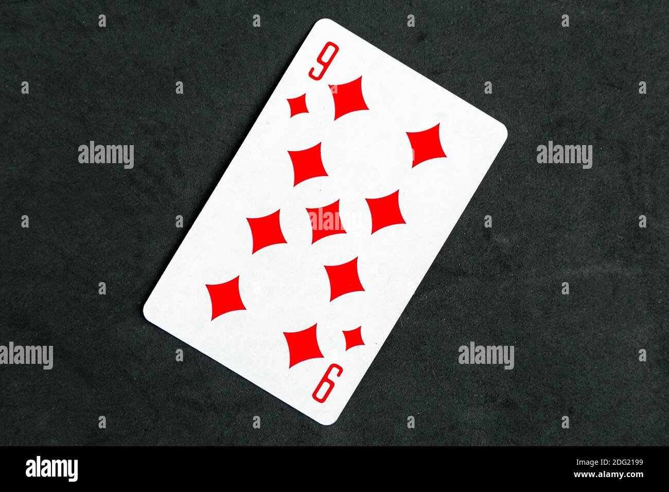 Nine of Diamonds playing card, black background Stock Photo - Alamy