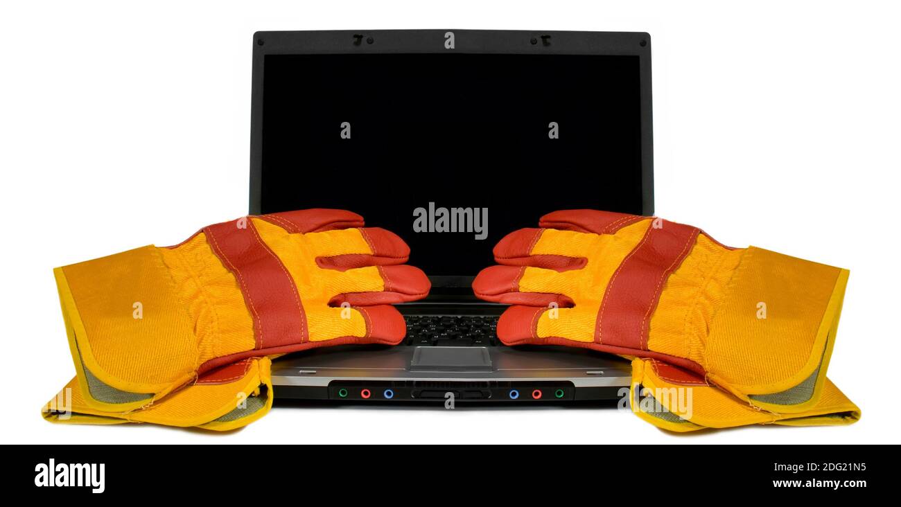 Protective gloves on a laptop isolated. Empty black desktop for your text. Industrial concept Stock Photo