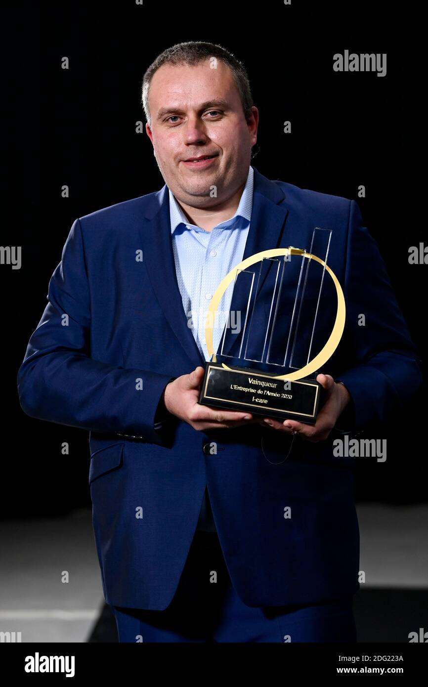 I-Care CEO Fabrice Brion poses with the trophy, at the award ceremony for the the 'Entreprise de l'annee' (French-speaking company of the year), Monda Stock Photo