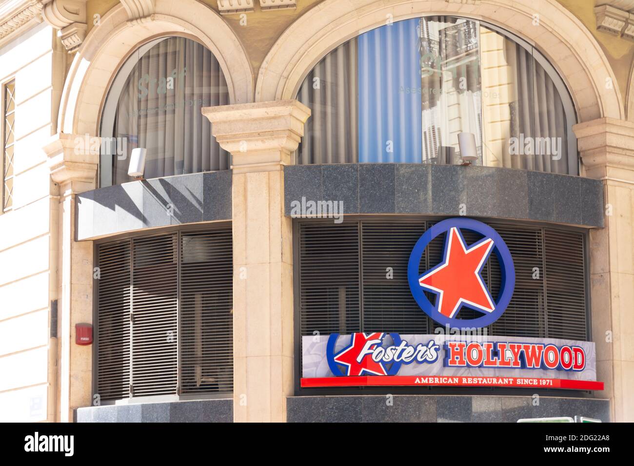 Valencia Spain. September 27, 2020: Fosters Hollywood restaurant sign and logo above one of its entrances. Located in the town hall square Stock Photo