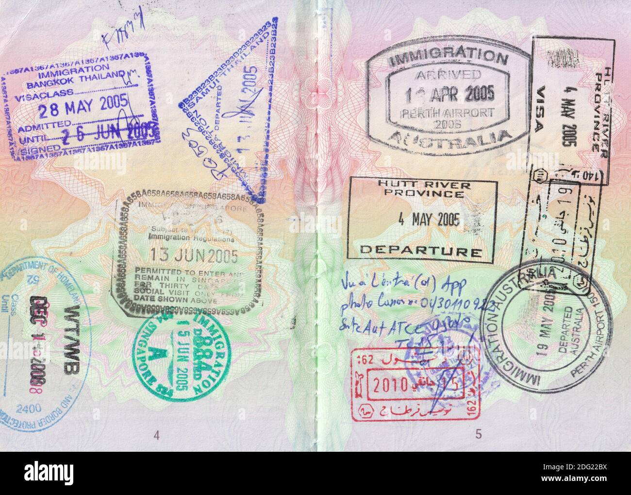 UK passport pages with stamps from USA, Thailand, Singapore, Australia, Tunisia and Hutt River Province (see description for full details) Stock Photo