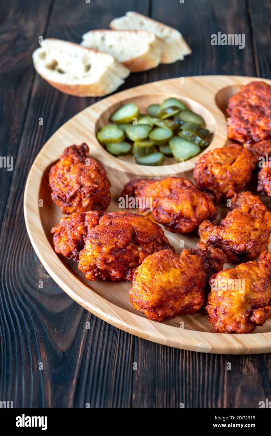 Nashville Hot Chicken covered in cayenne pepper sauce Stock Photo Alamy