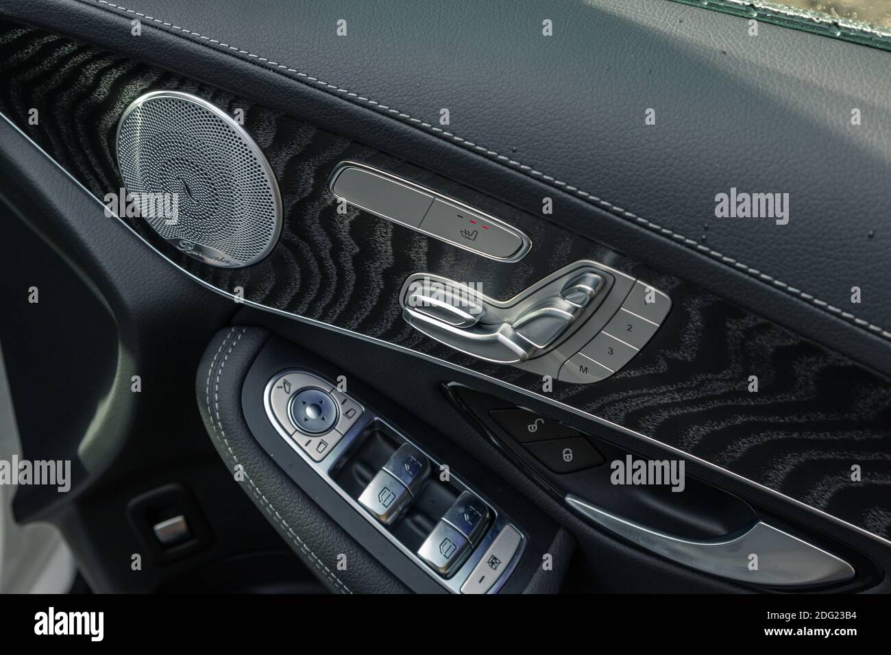 A closeup shot of a modern car door handle interior details with
