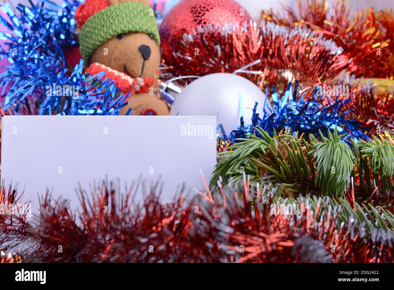 2021 Happy New Year and Christmas card with Teddy Bear, Balls and Gifts. New year and Christmas invitation background. Stock Photo