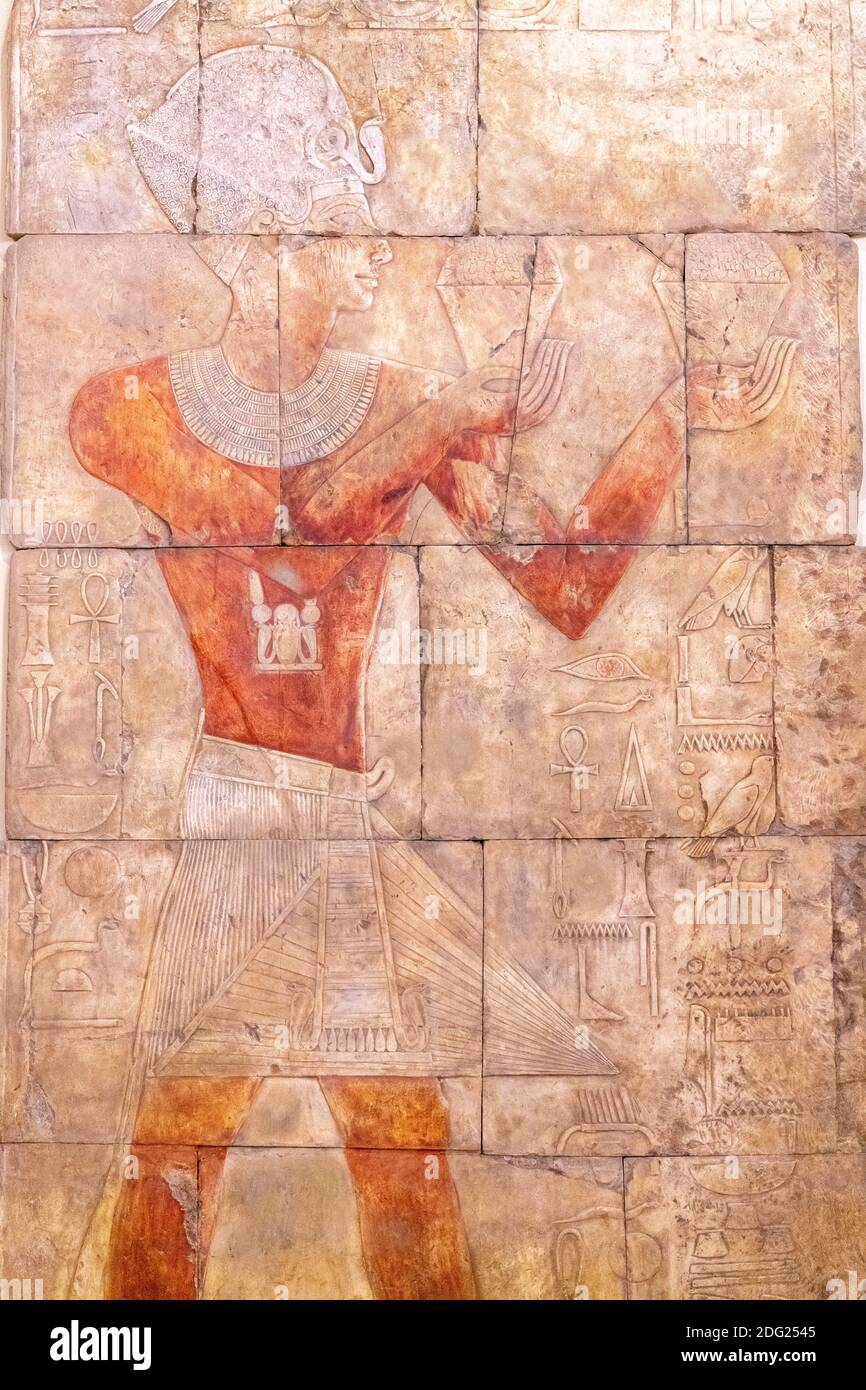 Thutmose III offers two containers of incense to the god Amun. The item