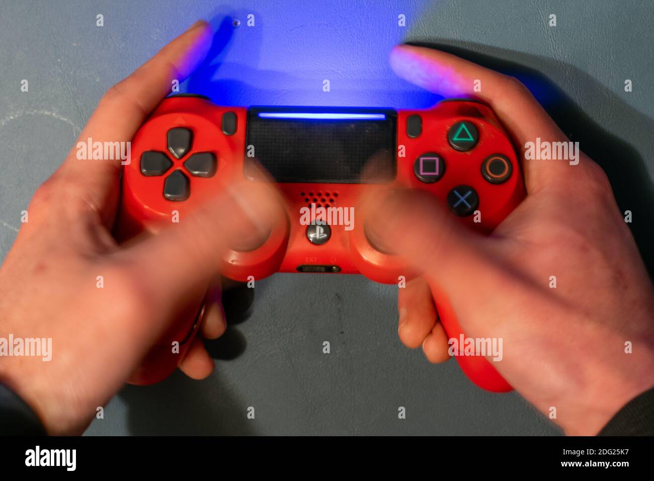 December 5, 2020 - Elkins Park, Pennsylvania: A Red PS4 Controller With  Motion Blur Over the Thumbsticks Showing the Controller Being Used Stock  Photo - Alamy