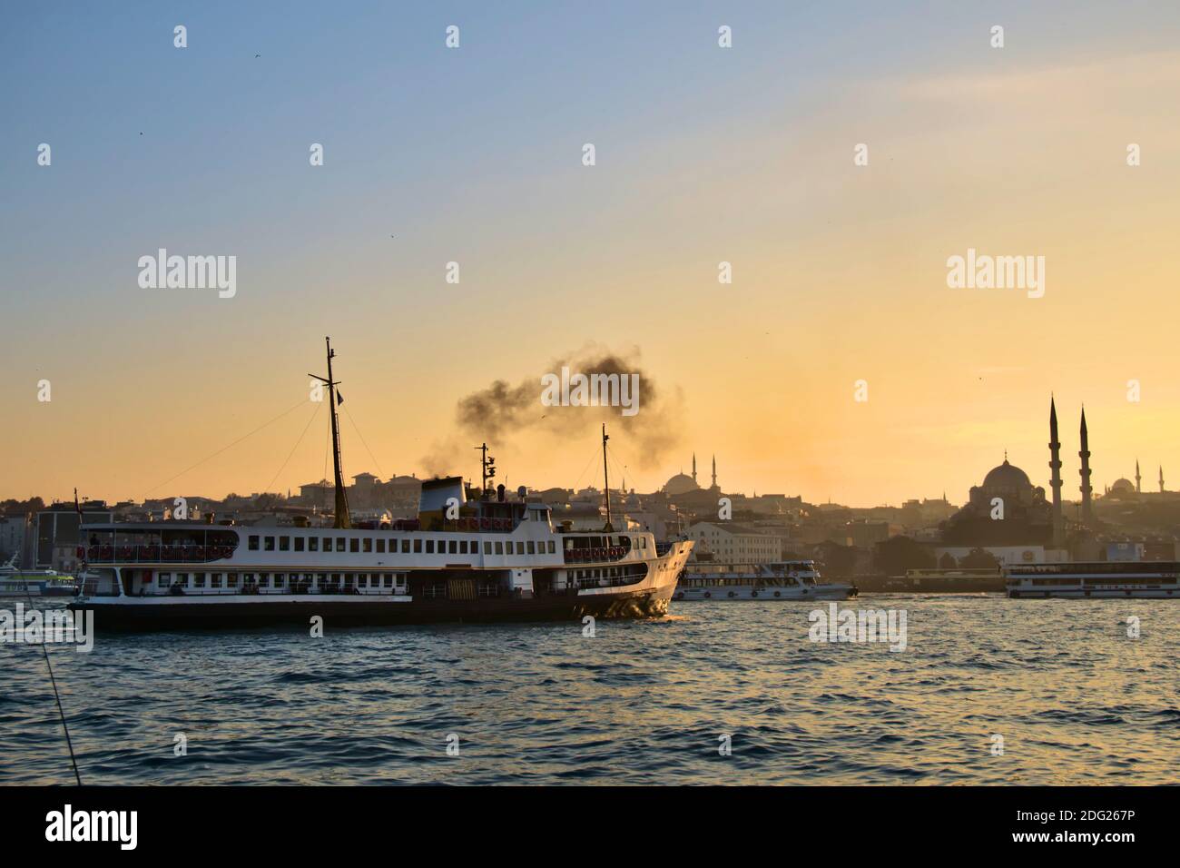 Historical passengers steamer and sunset view of Istanbul city. Stock Photo