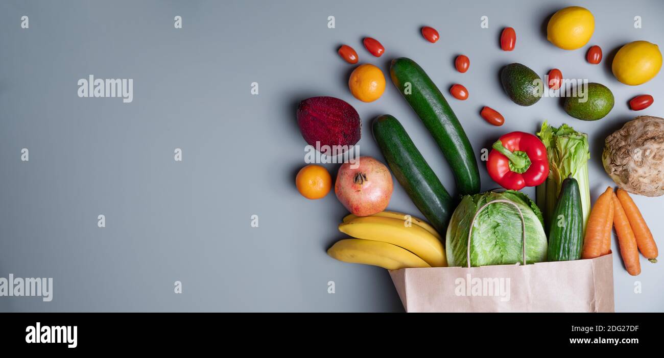 Bag of healthy vegetables on a gray background with copy space. Online shop concept. Stock Photo