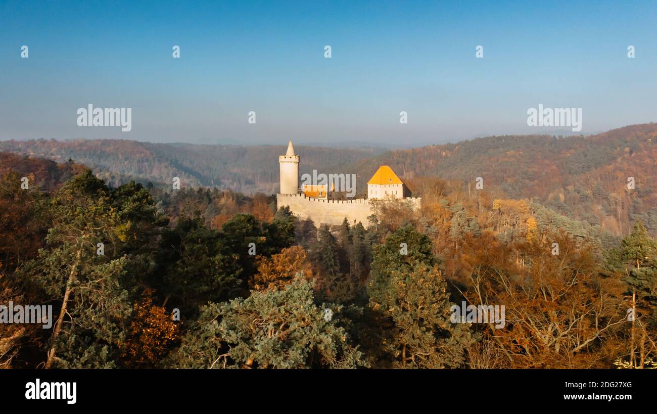 Aerial fall view of old stone Kokorin Castle built in 14th century.It lies in the middle of nature reserve on a steep rocky spur above the Kokorin Stock Photo