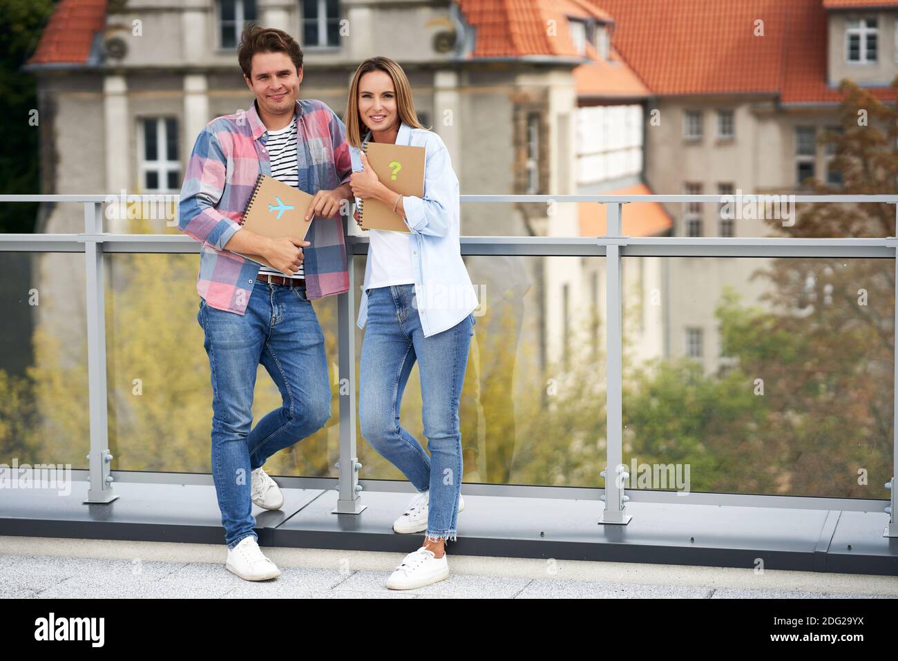 Couple of students standing together in the campus Stock Photo