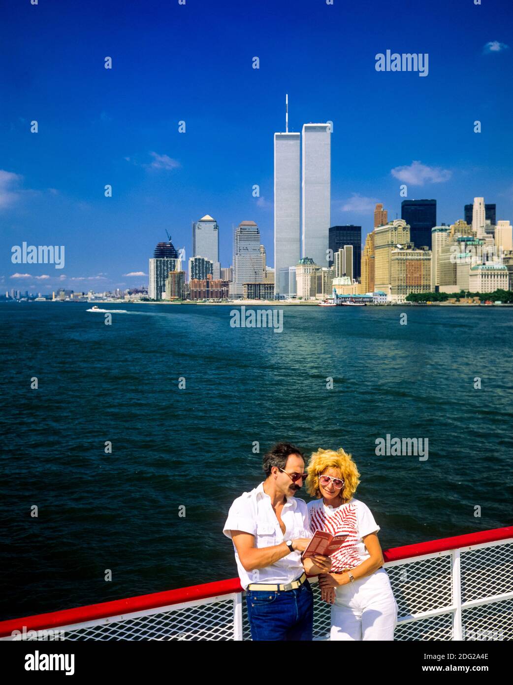 New York 1985, tourists couple, sightseeing boat river cruise, WTC World Trade Center twin towers, Manhattan skyline, New York City, NY, NYC, USA, Stock Photo