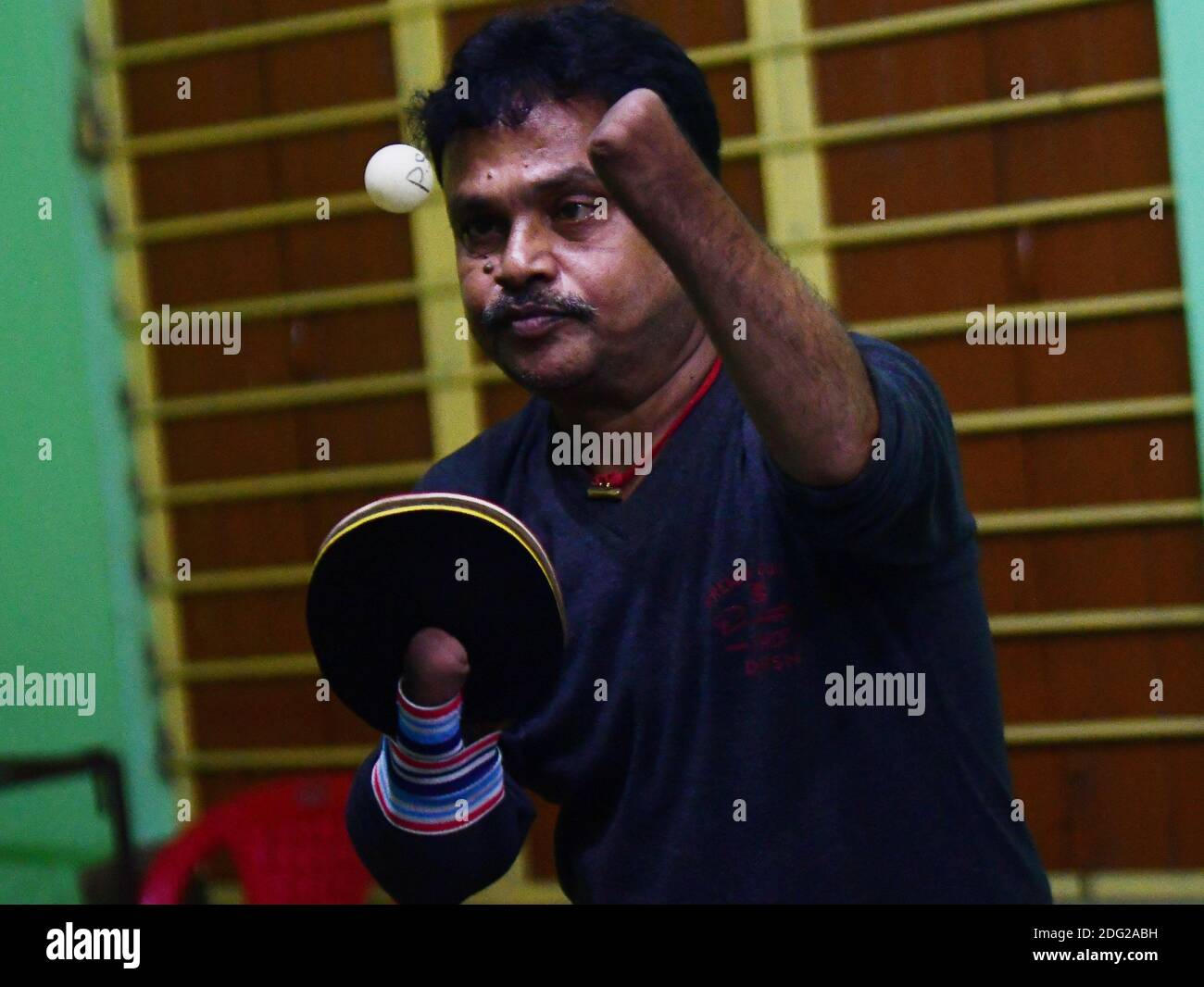 Kajol Dey, a 49 year old disabled table tennis player and coach is seen