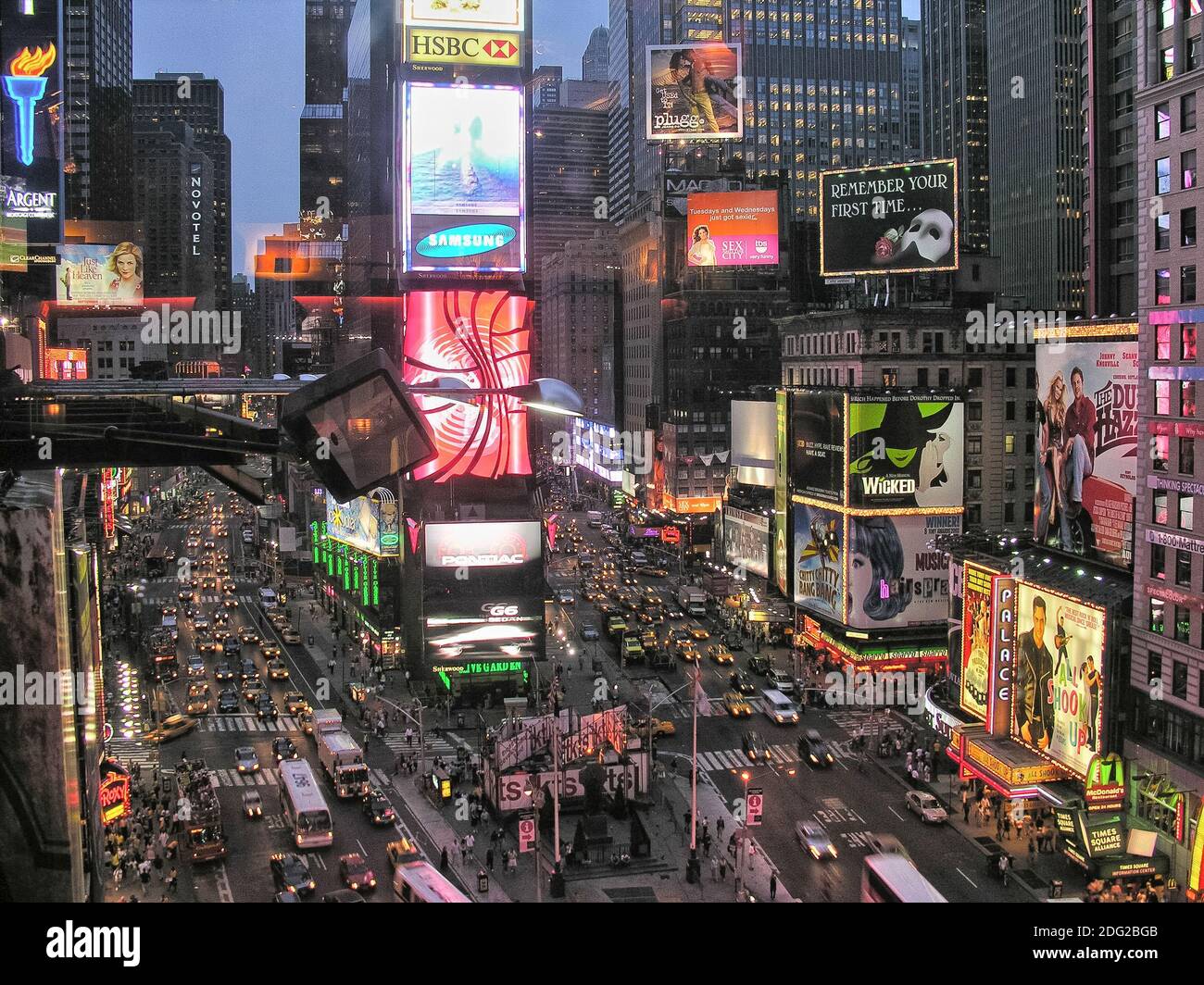 NEW YORK CITY - AUG 11: Times Square ,is a busy tourist intersection of neon art and commerce and is an iconic street of New Yor Stock Photo