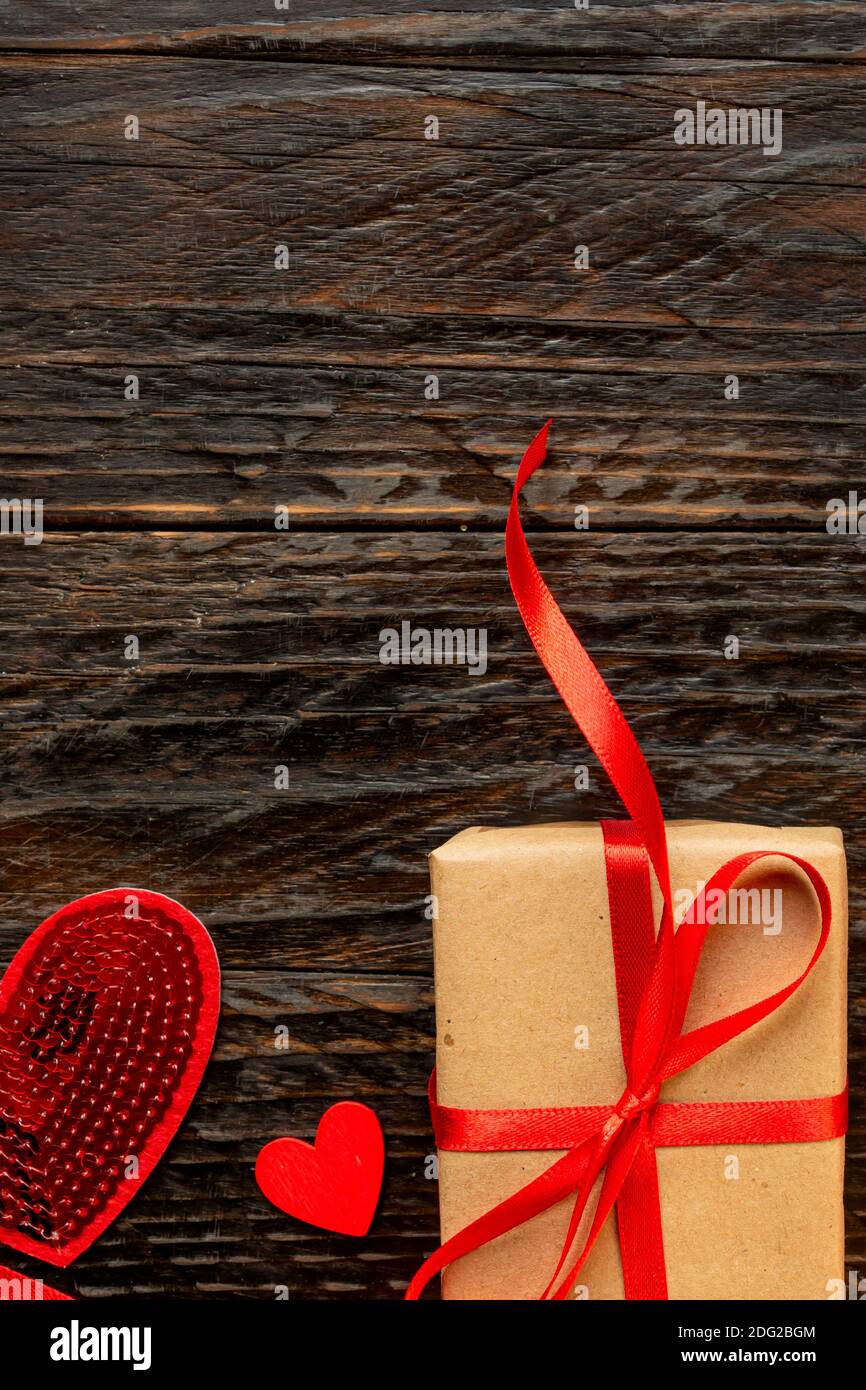 Paper craft Gift box with red ribbon bow and red hearts. Festive ...