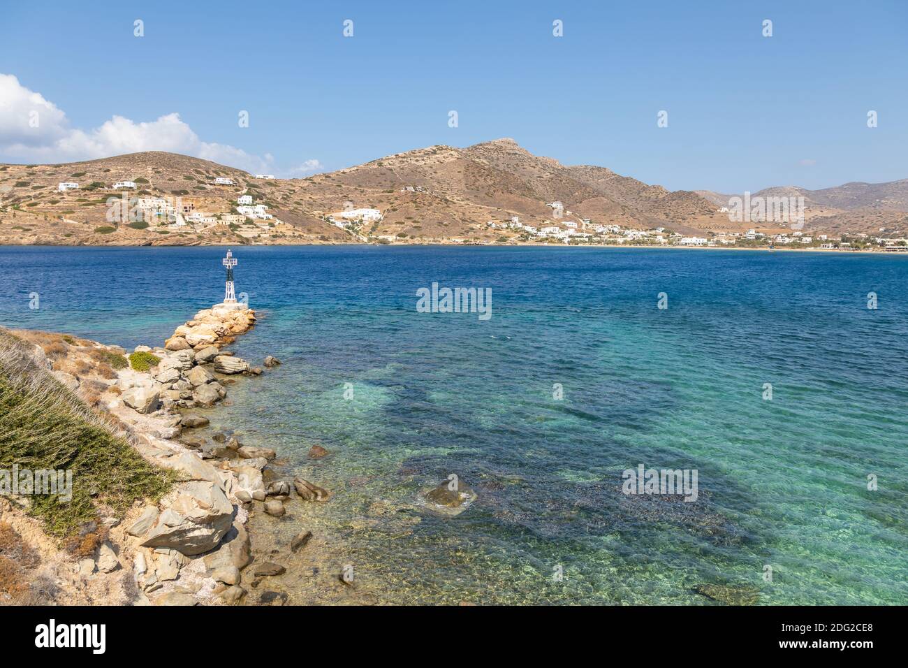 View of the small lighthouse on the rock. Chora , Ios Island, Greece ...