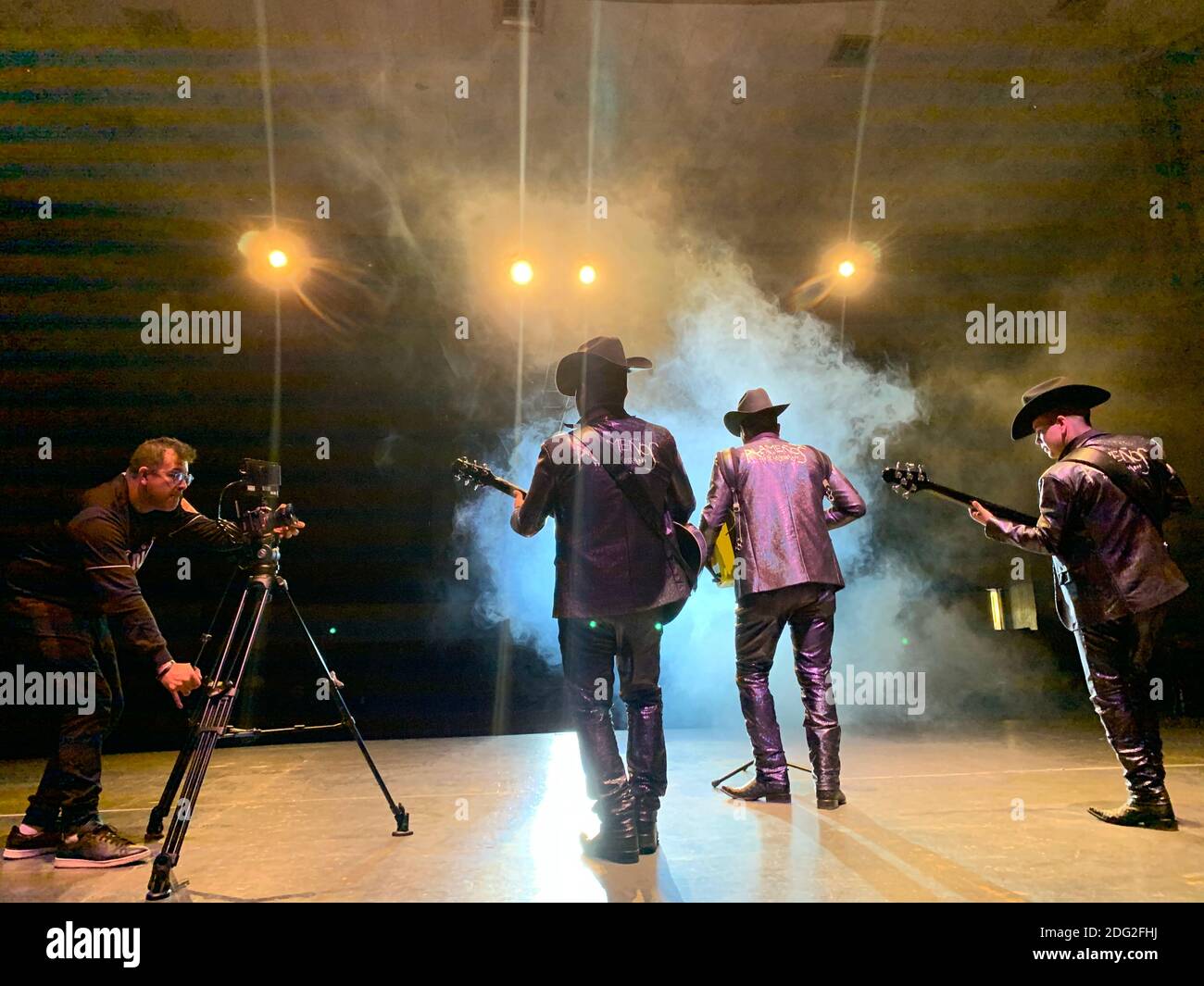 Sierreño Genre Example Musical production, recording of music video clip of a group from the ...
