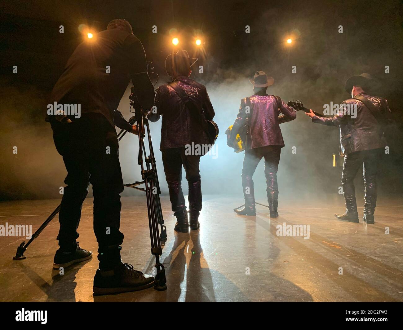 Sierreño Genre Example Musical production, recording of music video clip of a group from the ...