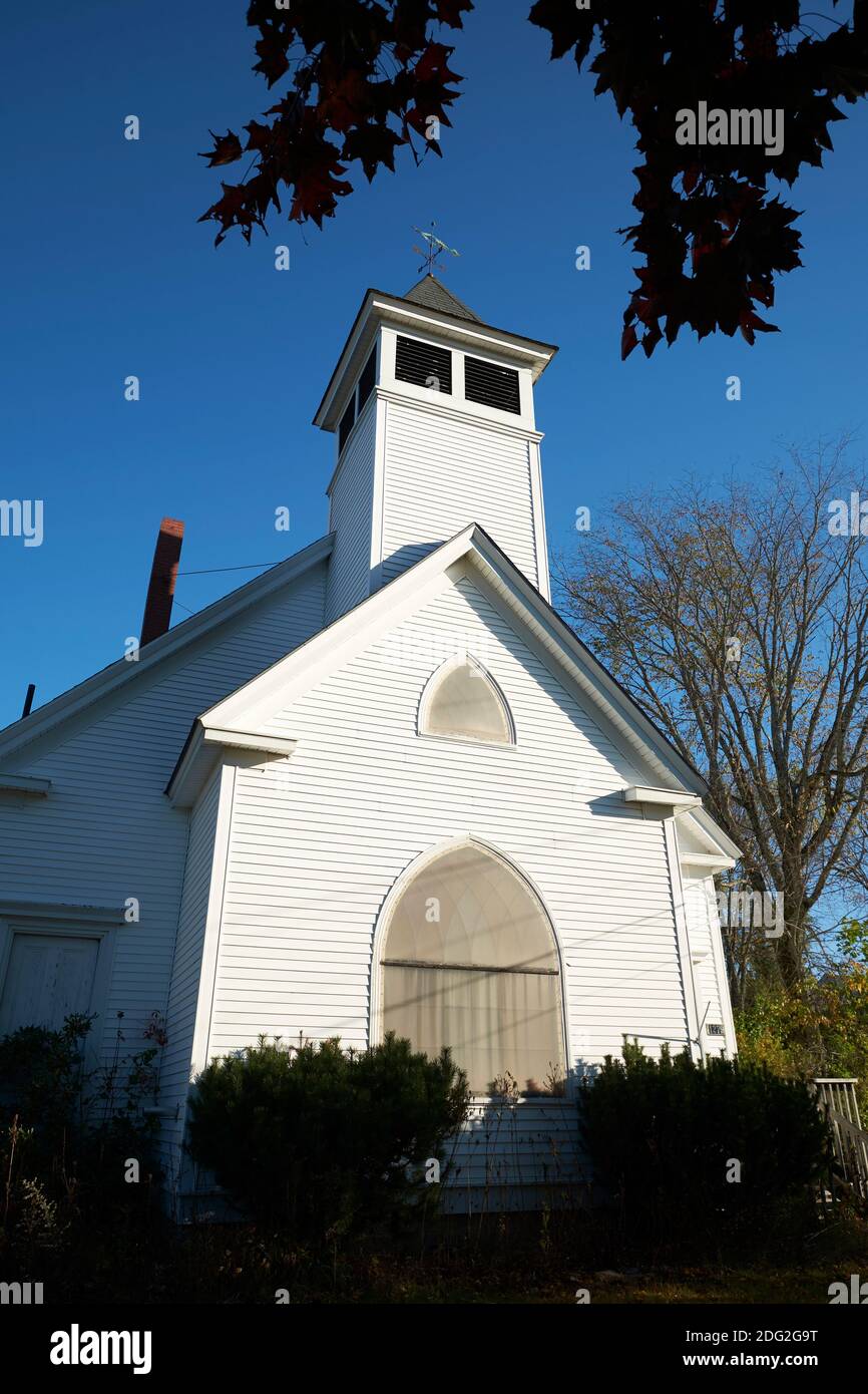 An old, white, clapboard siding church. In Surry, Maine. Stock Photo