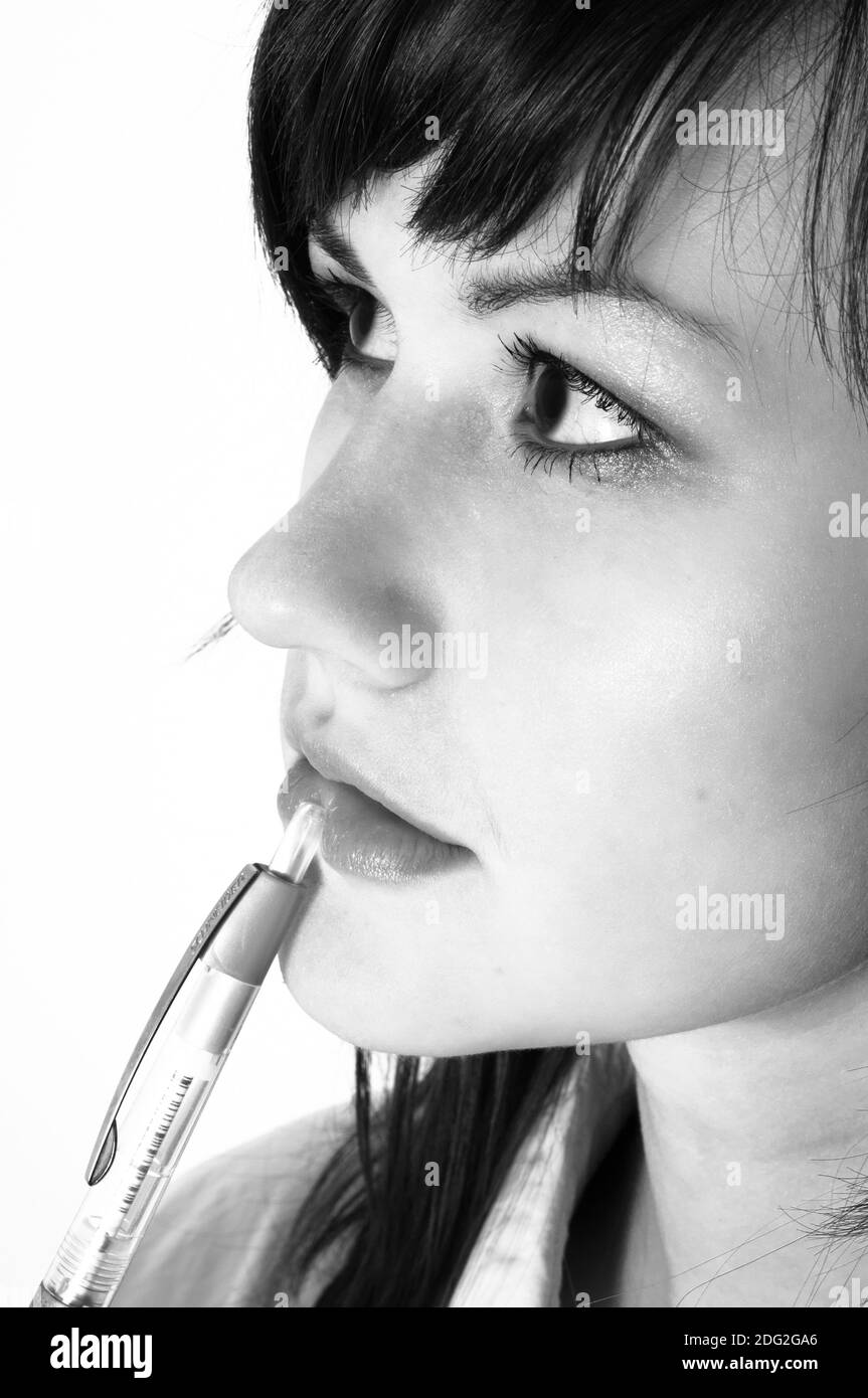 Girl thinking with pencil hi-res stock photography and images - Alamy
