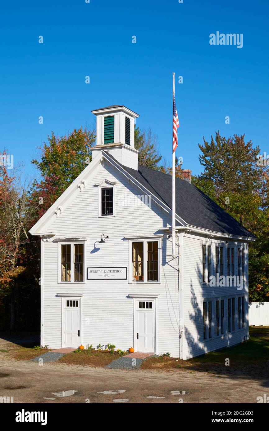 Exterior of the old, white, clapboard, siding Surry Village School with