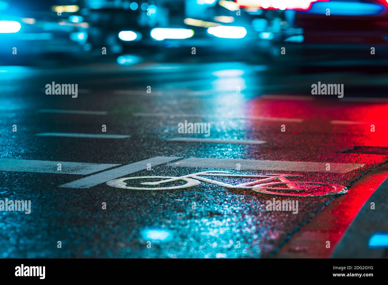 Symbol of a Bike on a street in a big city with cars in the background Stock Photo
