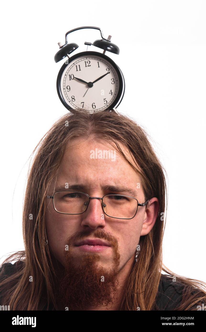 Handsome man with clock on his head Stock Photo - Alamy