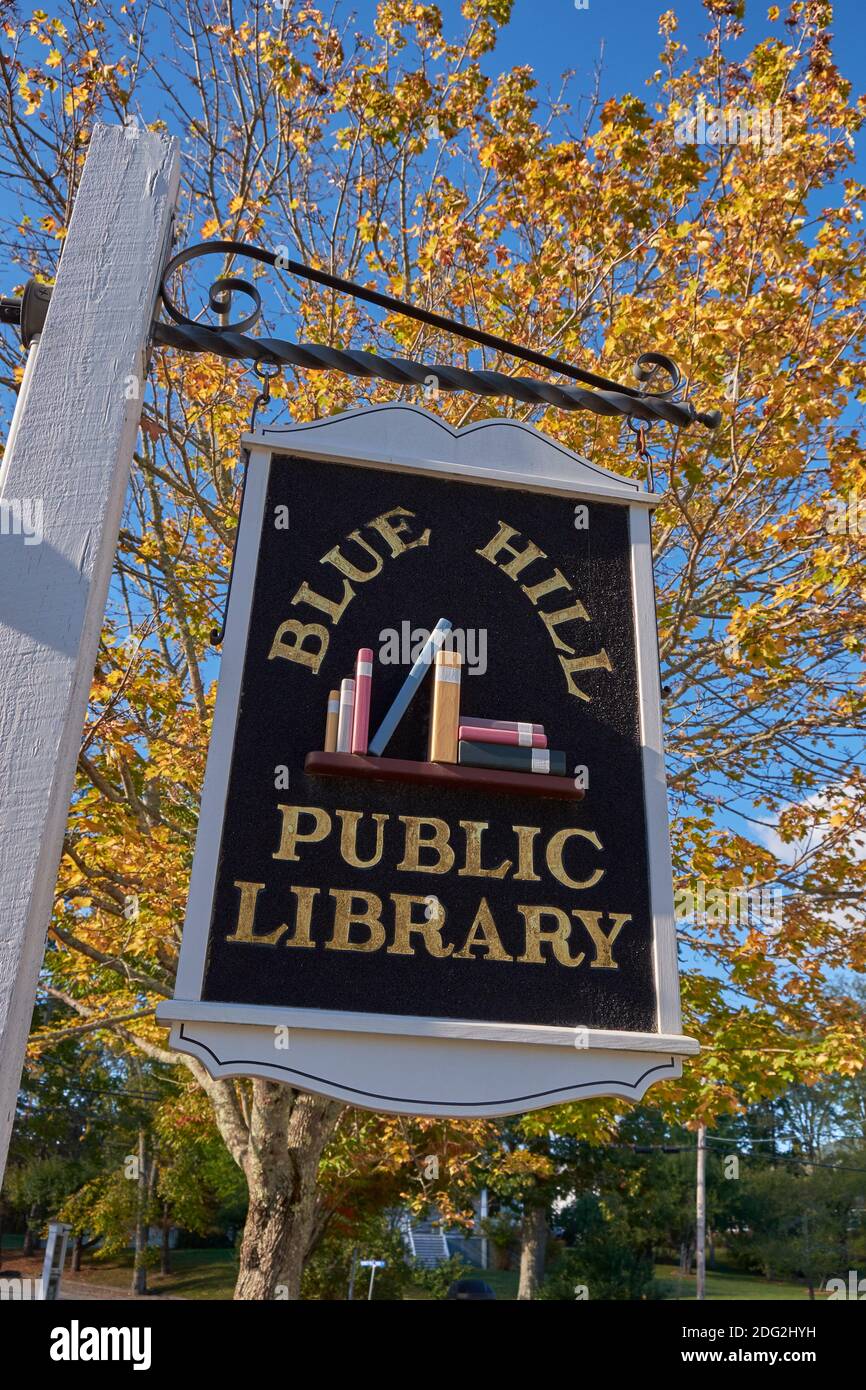 The ols style, painted, hanging sign for the Blue Hill Library. In Blue Hill, Maine Stock Photo
