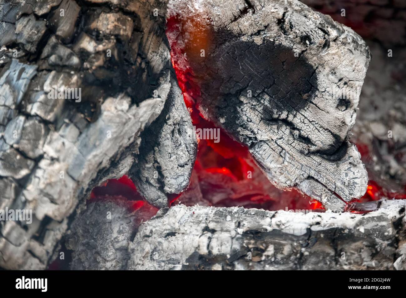Smouldering embers of burning wood, closeup in details Stock Photo