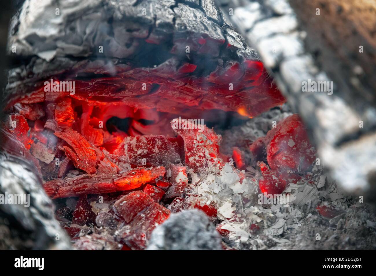 Smouldering embers of burning wood, closeup in details Stock Photo