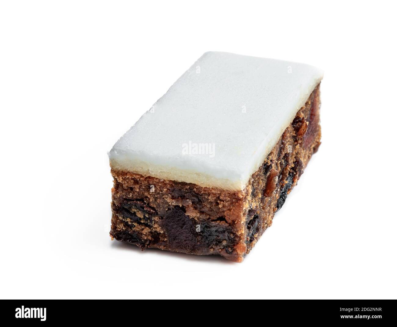 Fruit  cake slice topped with marzipan isolated on white Stock Photo