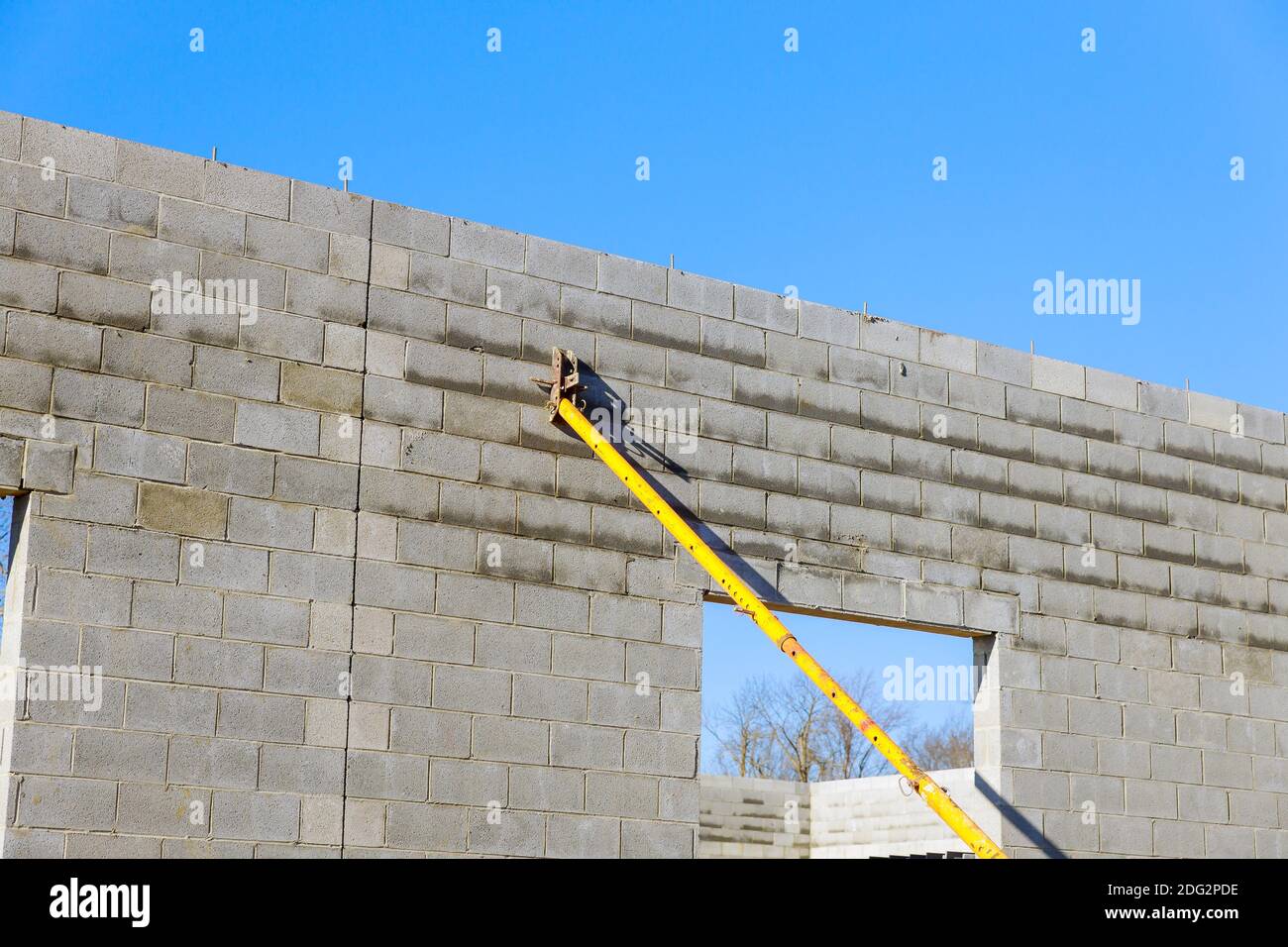 Concrete block, raw material for industrial wall supporting the walls