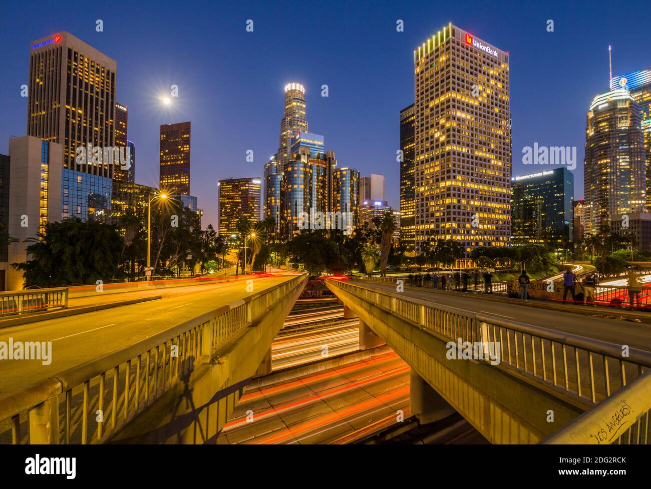 View of Downtown skyline and Harbour Freeway at dusk, Los Angeles, California, United States of America, North America Stock Photo