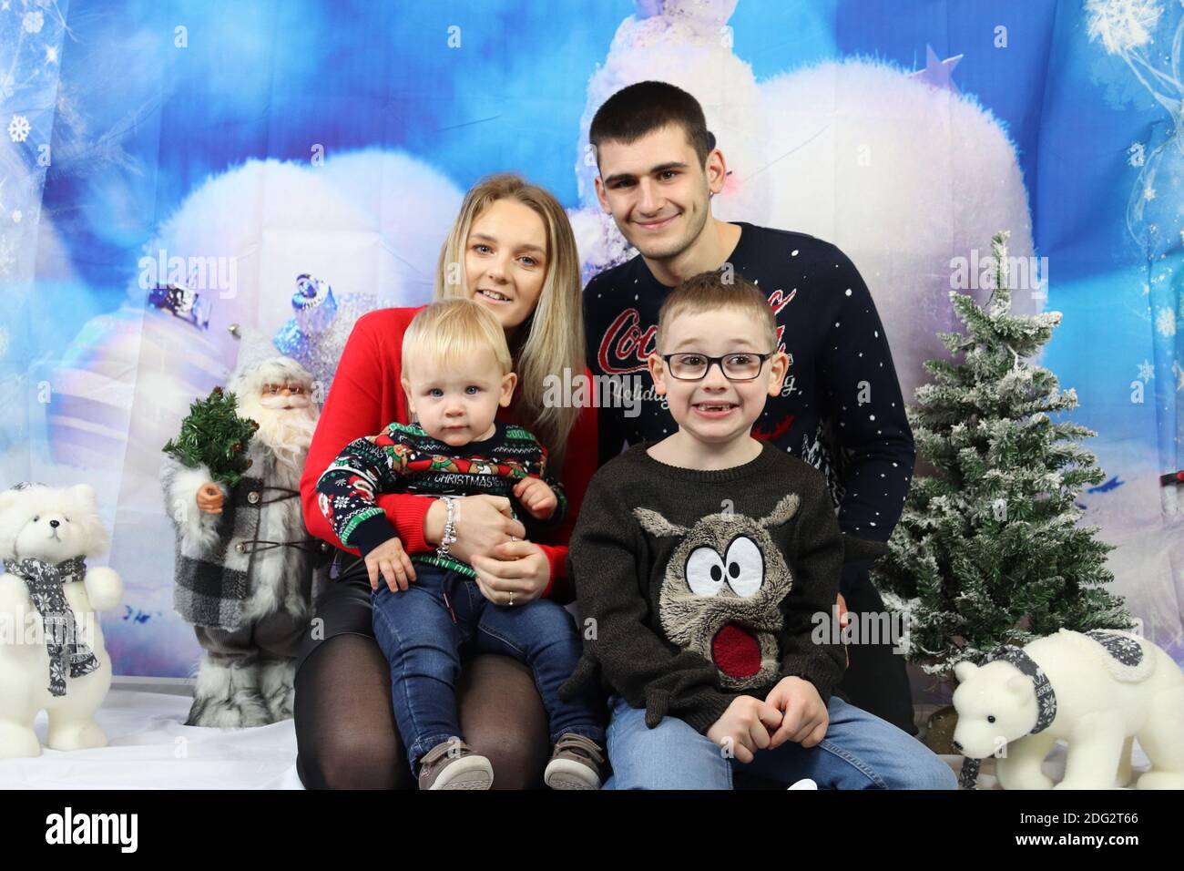 A traditional happy family Christmas photoshoot with a Christmas