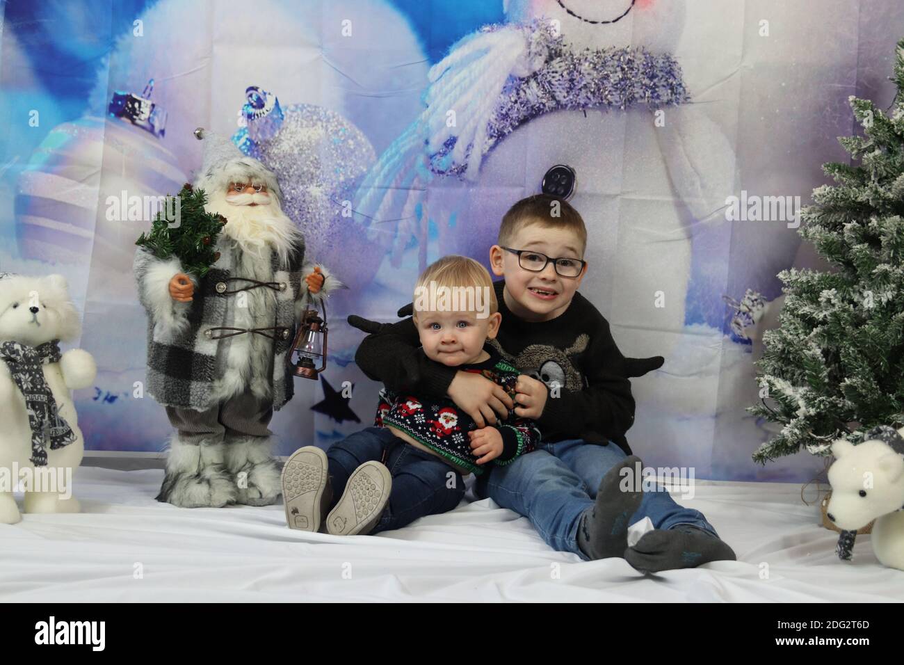 A traditional happy family Christmas photoshoot with a Christmas