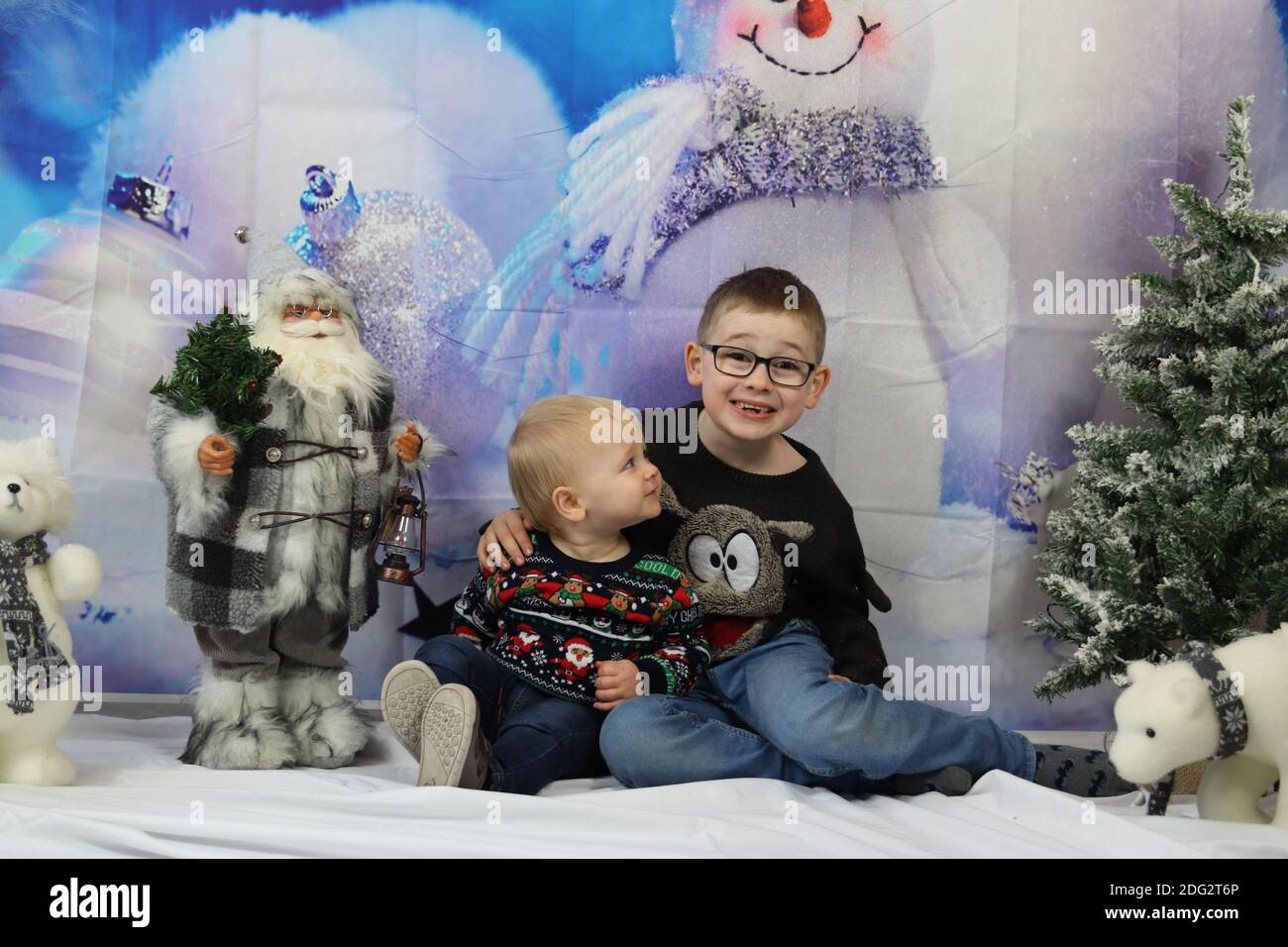 A traditional happy family Christmas photoshoot with a Christmas