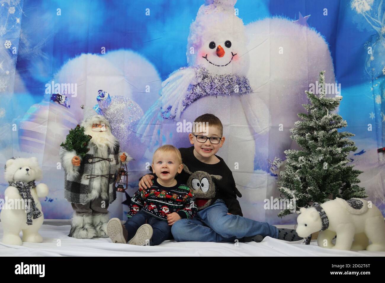 A traditional happy family Christmas photoshoot with a Christmas